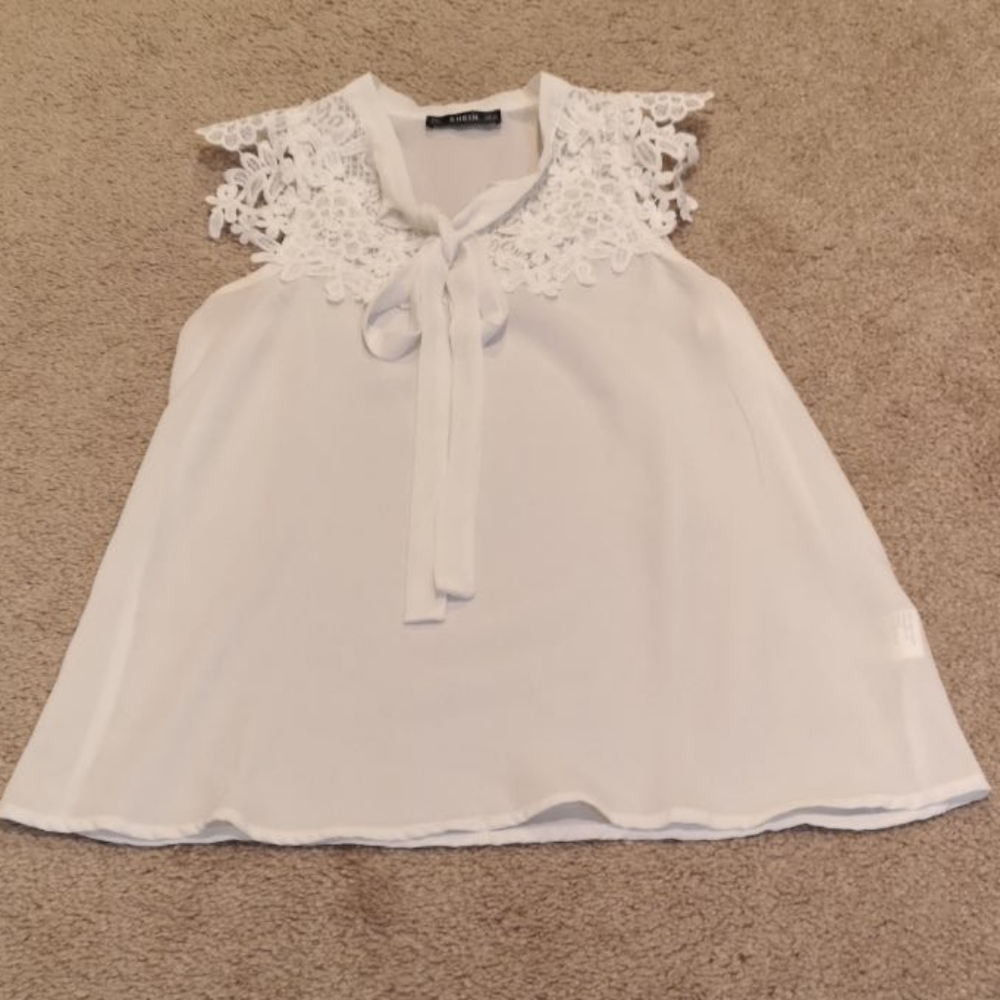 White sleeveless blouse